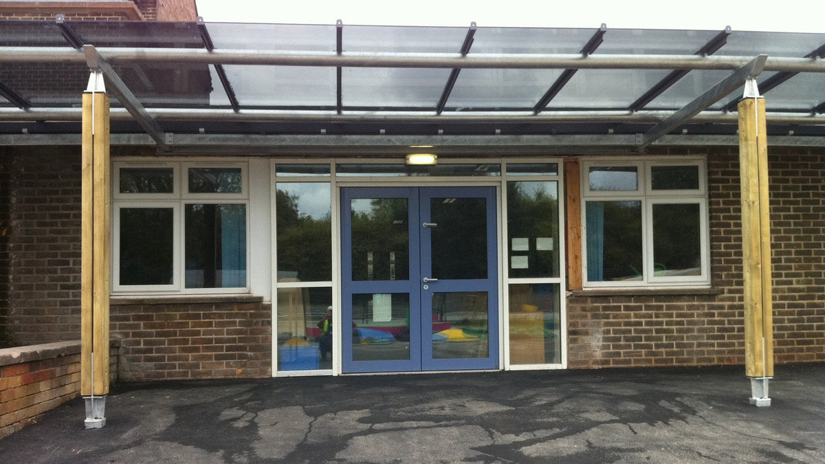 Bespoke steel and tinted glass canopy over the entrance doors of a Sheffield school