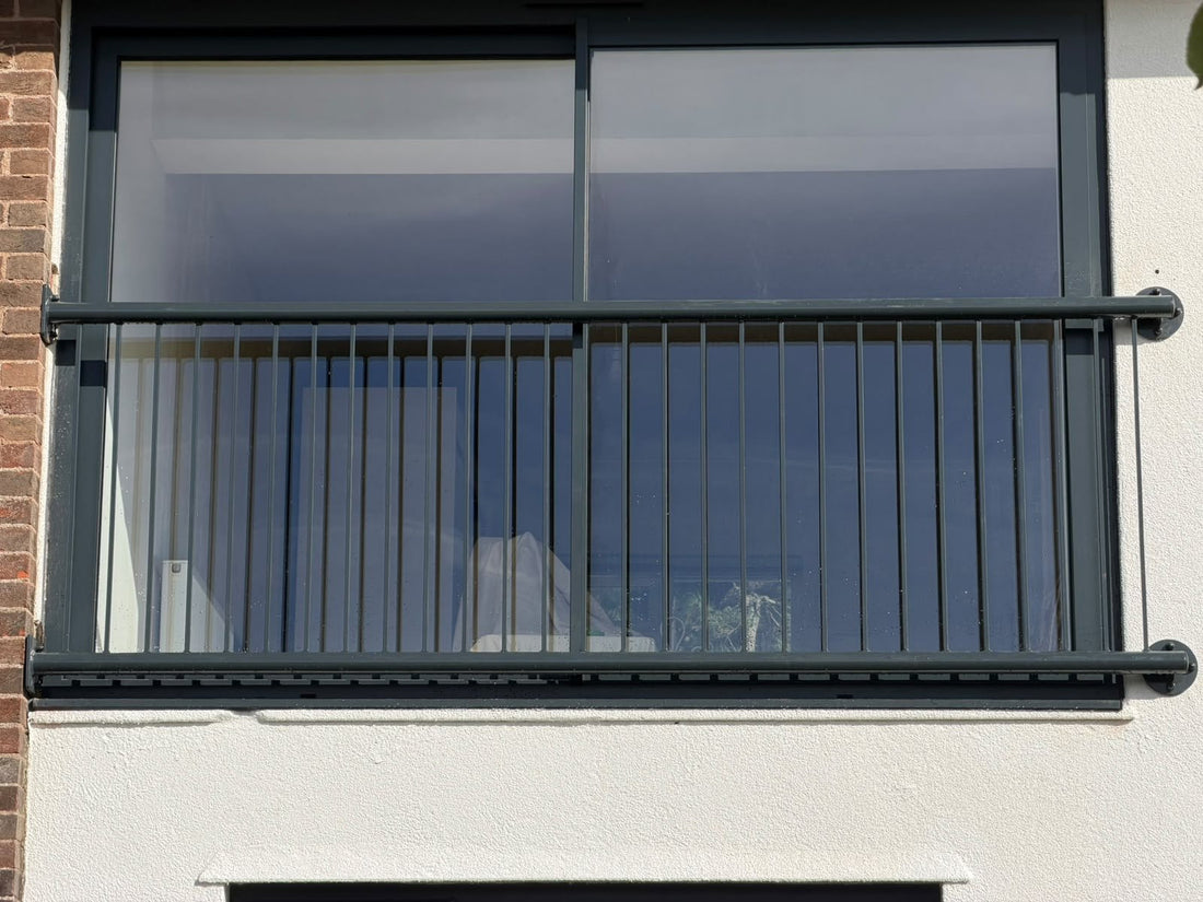 Wide span metal bar Juliet balcony in RAL 7016 anthracite grey across a 2930mm sliding door opening, Thornbury