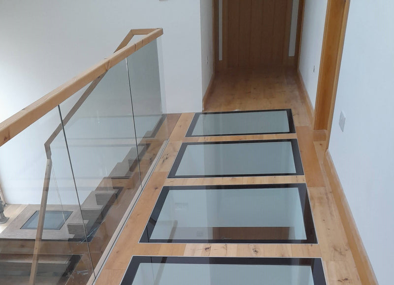 Walk-on glass floor panels set into a steel framework