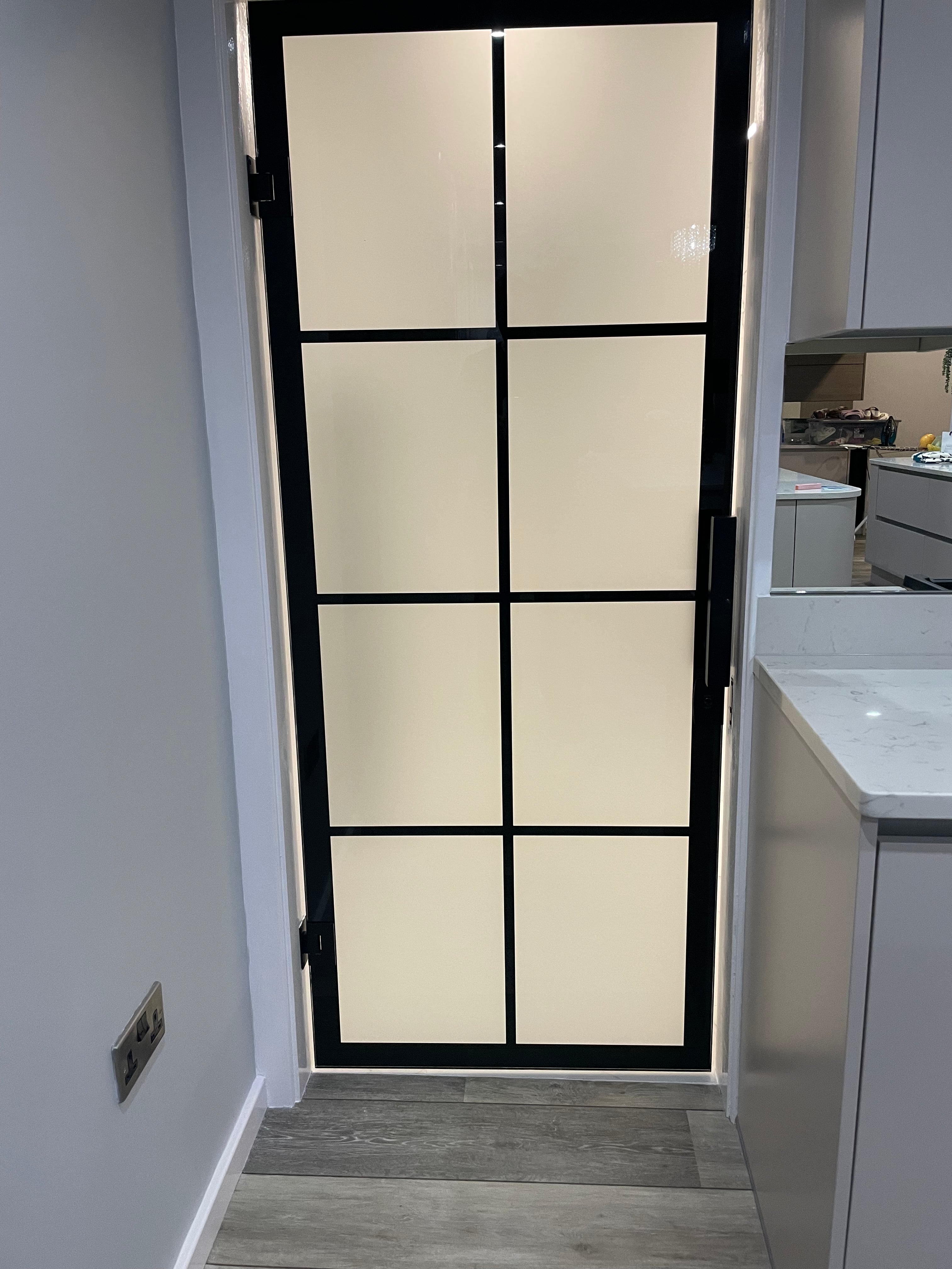 Made to measure frameless glass partition doors dividing a living space