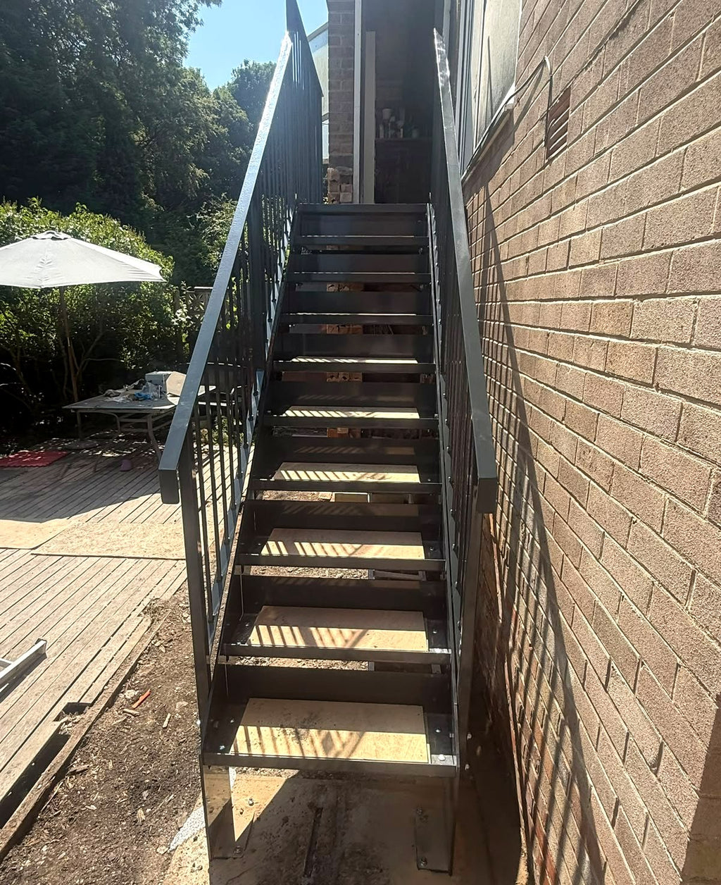Anthracite grey steel garden staircase with metal railings