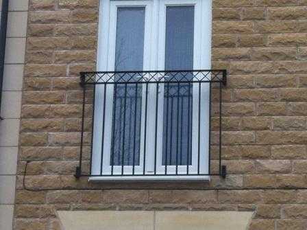 Galvanised steel Juliet balcony with a criss cross feature and square infill bars