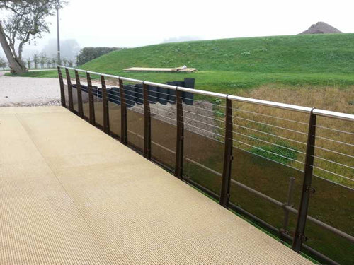 Bronze tinted glass balustrade against timber decking