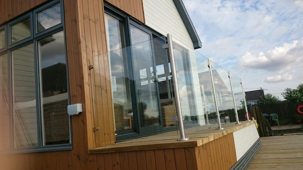 Caravan park balcony balustrade built from stainless steel posts and glass panels