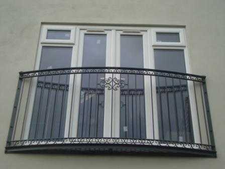 Curved Lancaster Juliet balcony with scrollwork and mesh platform