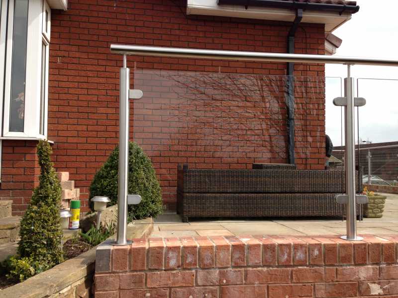 Stainless steel balustrade posts with handrail fittings
