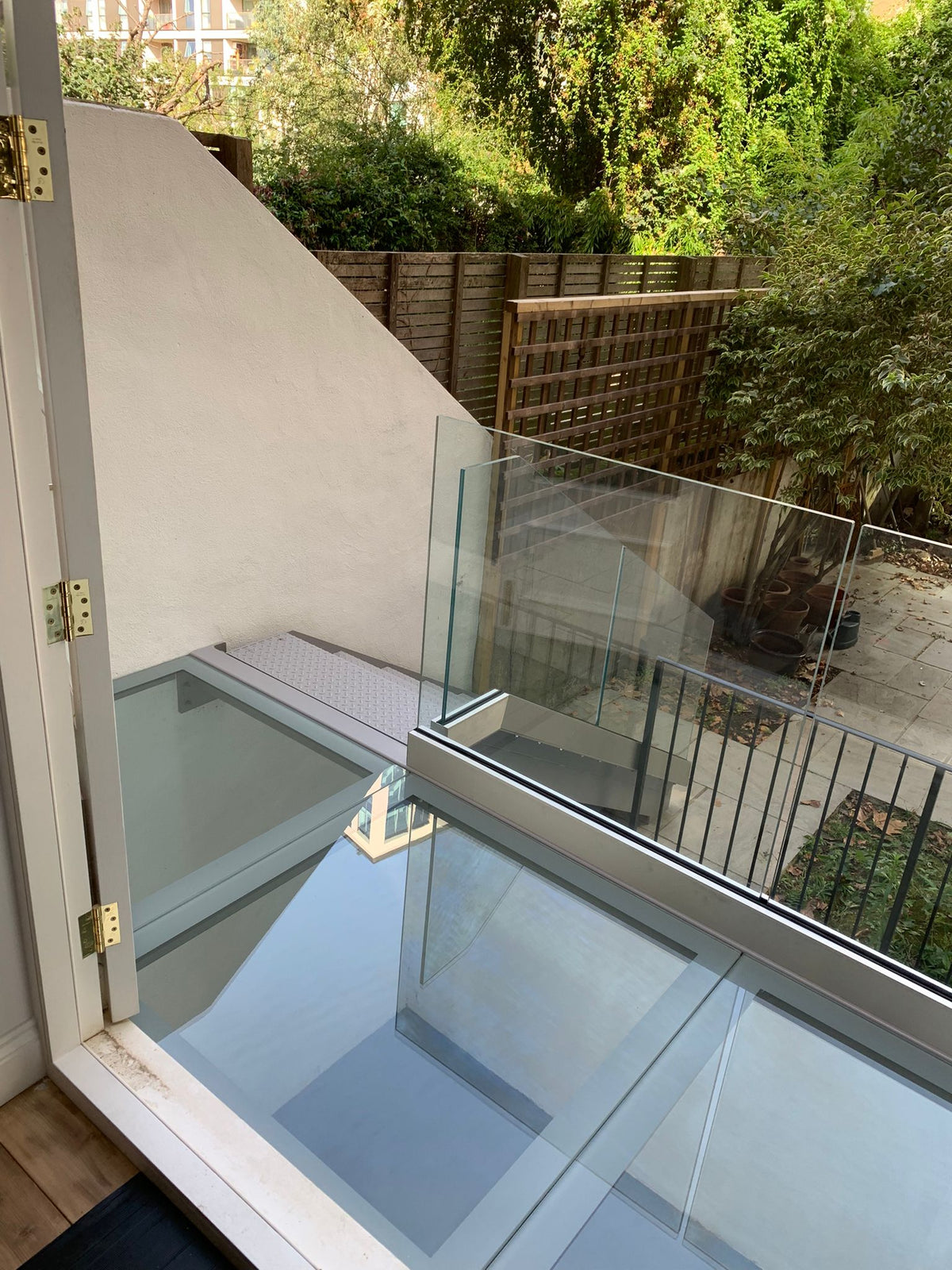 33mm walk-on floor glass to an external terrace with a frameless glass balustrade