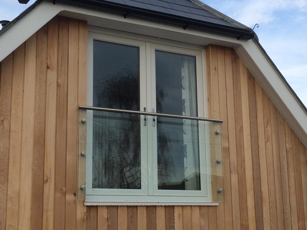 Frameless Juliet glass balcony system on stainless button fixings