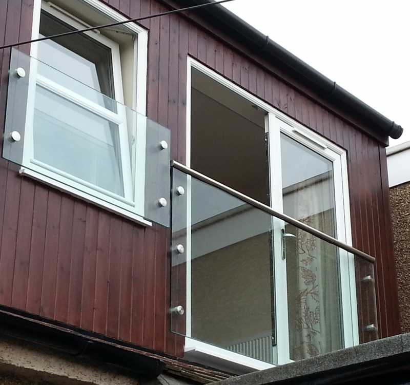 Frameless glass Juliet balcony with the optional handrail