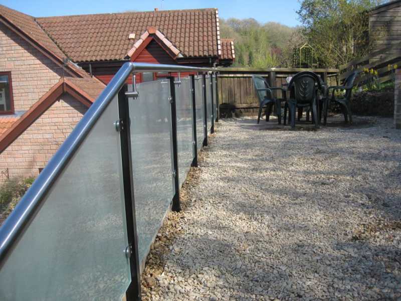 Frosted glass balustrade kit with a stainless handrail
