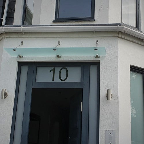 Suspended glass door canopy with frosted glass