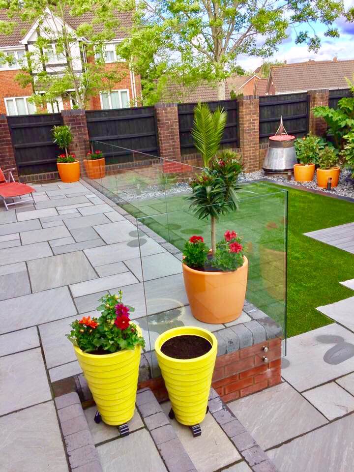 Frameless patio glass fencing to a garden edge