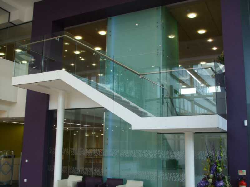 Frameless glass balustrade in 15mm toughened glass with a handrail