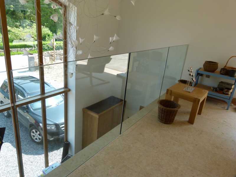15mm toughened glass panels set into a base channel