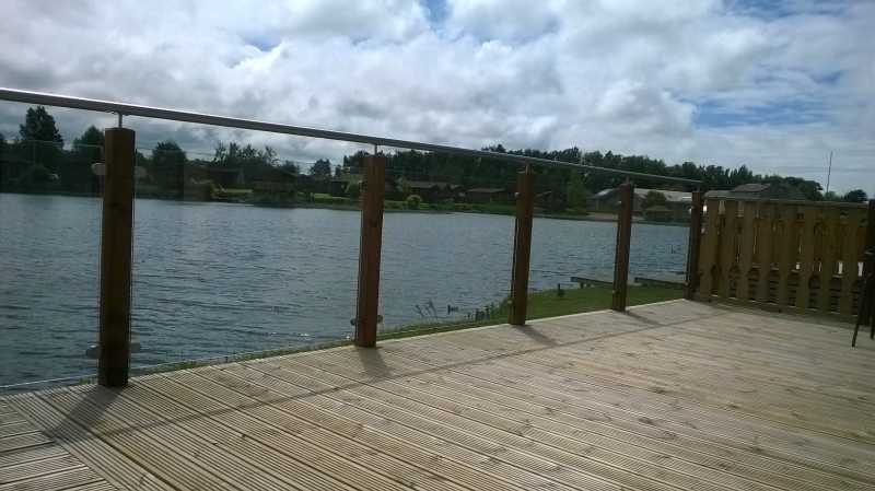 Glass deck panels on tanalised timber posts