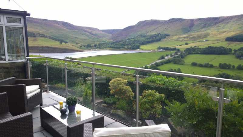 Stainless steel and glass balustrade to a terrace in the Peak District