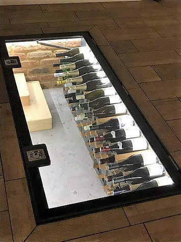 Walk on glass floor panel with a flush ring pull handle