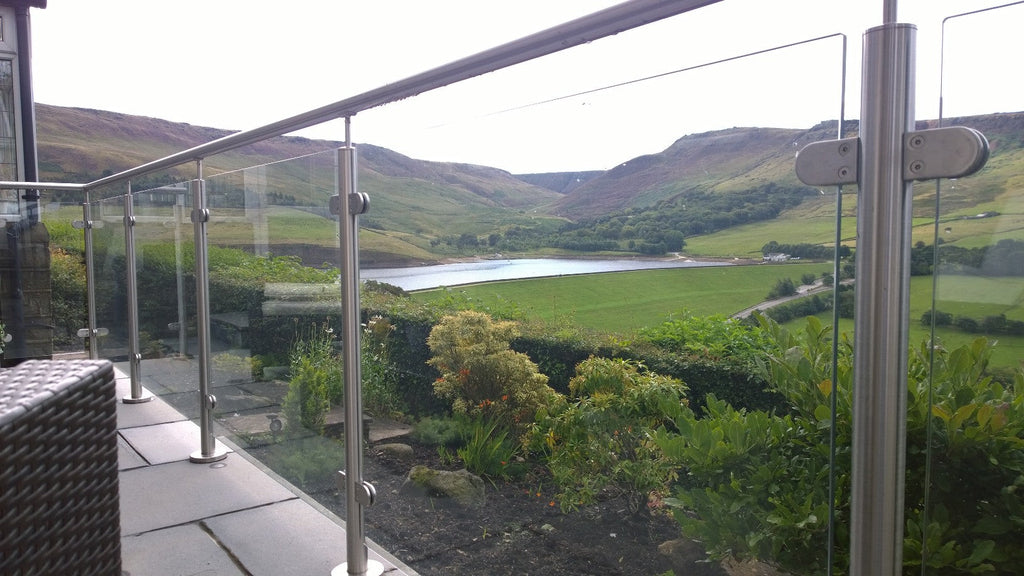 10mm toughened glass infill between stainless steel posts with a continuous top handrail, to a balcony overlooking a reservoir