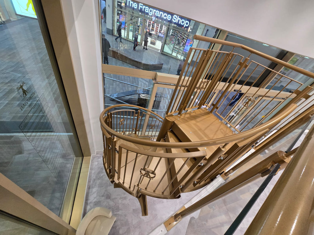 Gold powder coated spiral staircase viewed from above, Barnsley