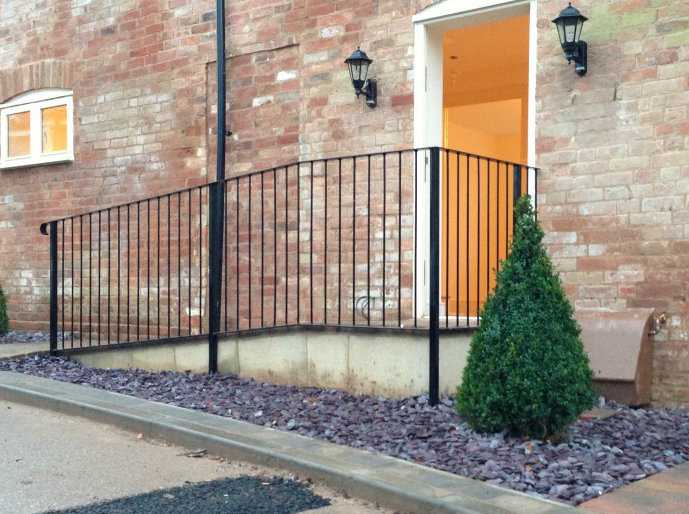 Ornate metal infill railings with decorative bar work