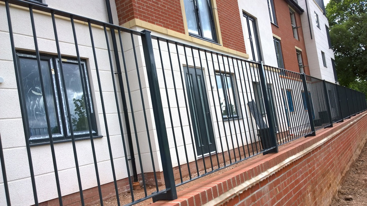 Metal railings set on a parapet wall
