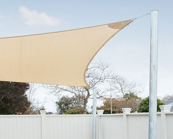 Shade sail tensioned from a heavy duty 60mm galvanised steel post against the sky
