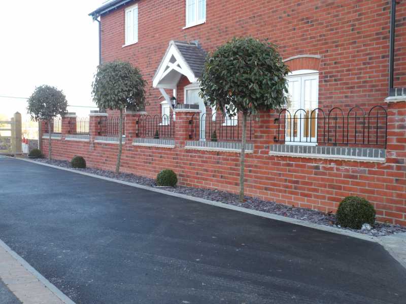 Short wall top railings raising the height of a boundary wall
