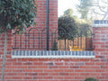 Wall top dwarf railings bolted down onto an existing low garden wall