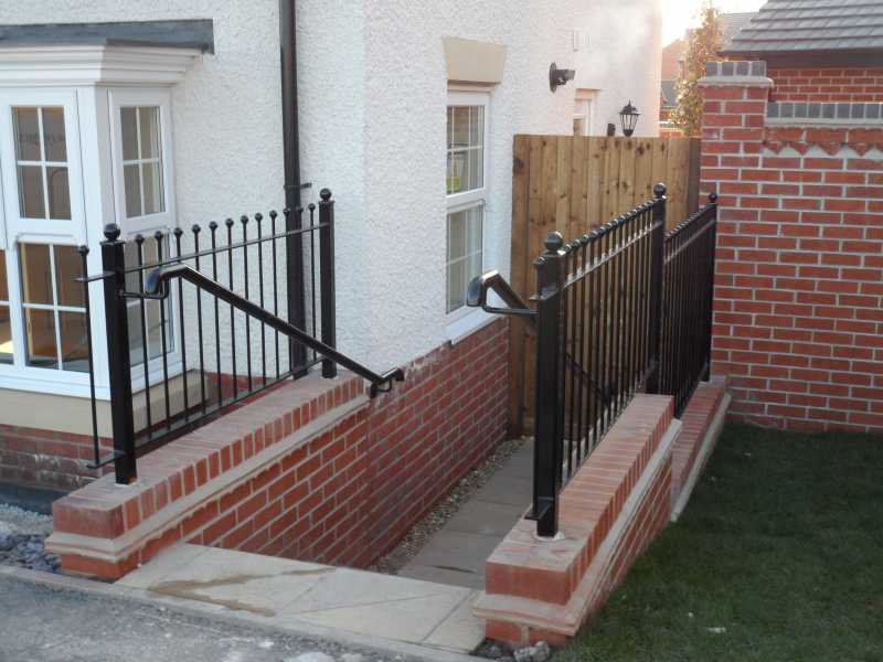 Ball top railings to a garden gateway