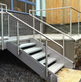 Stainless steel staircase handrail finished with terminating elbows