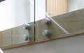 Brushed stainless side fixing glass adapter with an adjustable arm and glass jaws