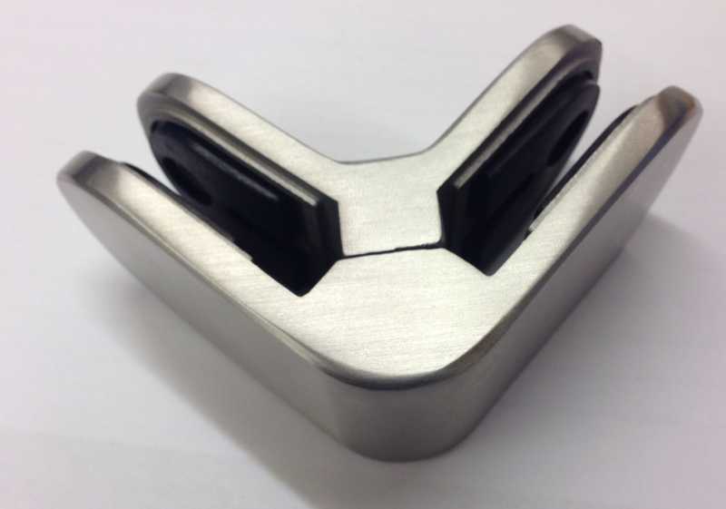 Underside of the corner clamp showing the two glass channels