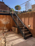 Steel staircase with glass balustrade