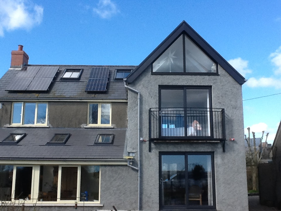 Walk-out Juliet balcony with metal railings and composite decking