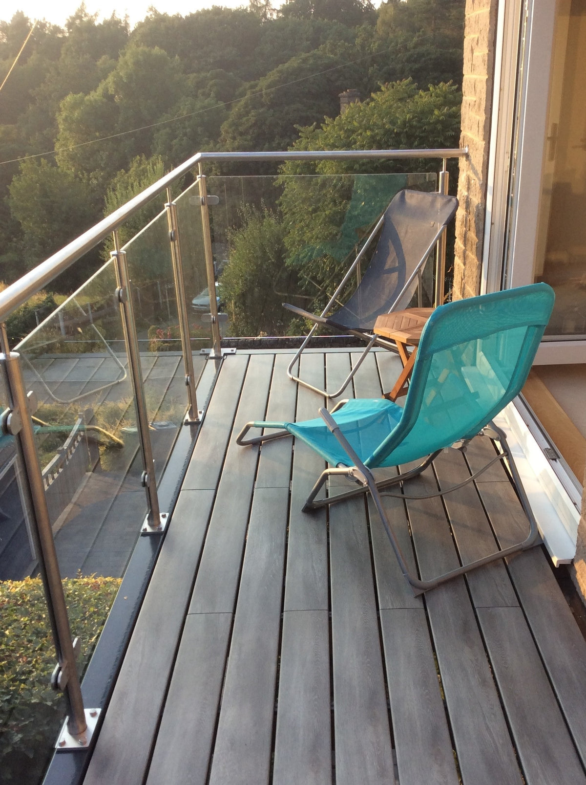 Walk-out balcony with framed glass balustrade and composite decking