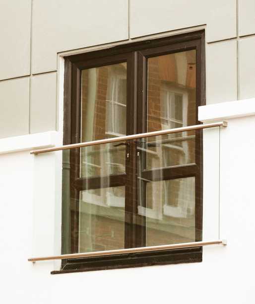 Wembley glass Juliet balcony in a slotted stainless rail