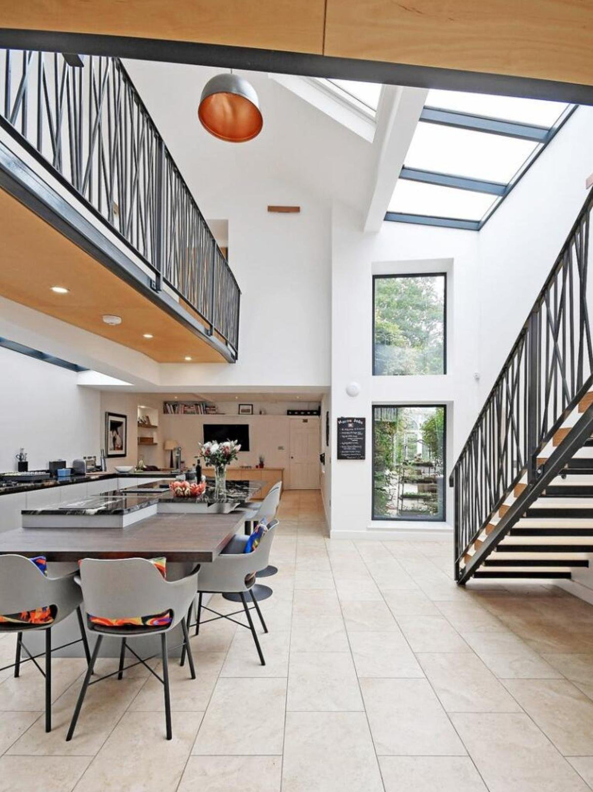Bespoke metal balustrade to a mezzanine walkway and matching steel staircase