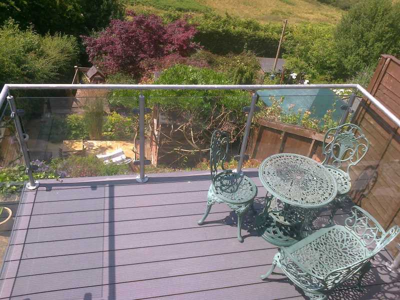 Bright galvanised finish on a glass balustrade run