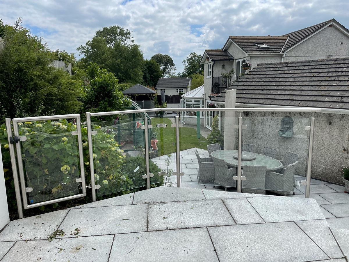 Mirror polished stainless steel and glass balustrade to a balcony