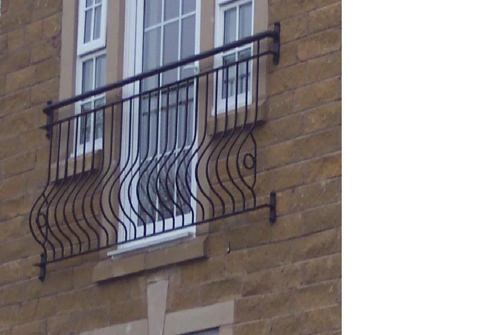 Loxley Juliet balcony showing the Spanish bow infill bars swelling through the middle