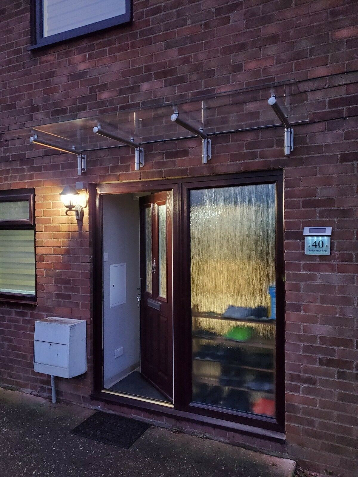 Large glass canopy over a front door