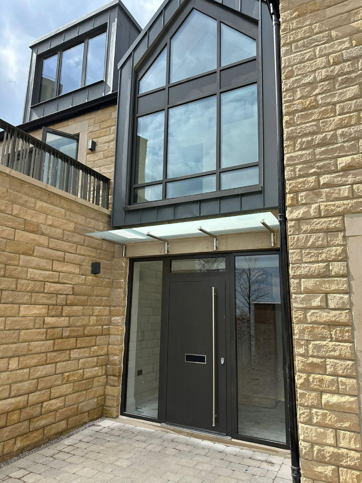 Frosted glass door canopies at Hallam Towers