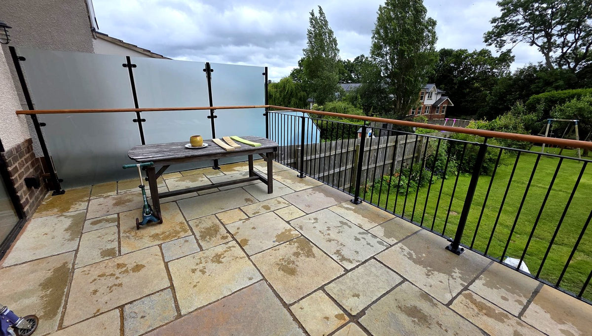Frosted glass privacy screen with an oak handrail to a terrace, Sheffield