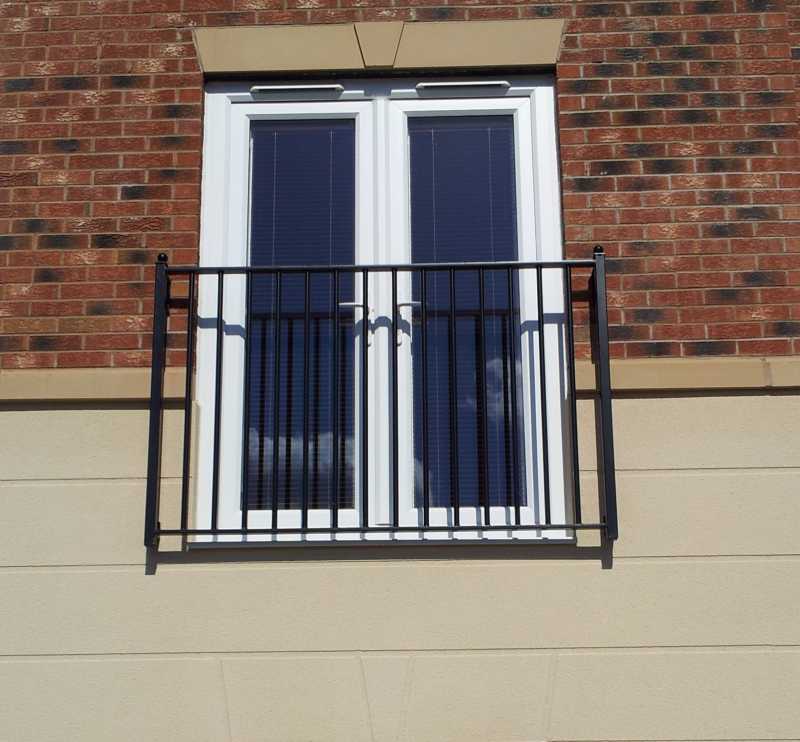Galvanised steel Juliet balcony with square infill bars and decorative ball tops