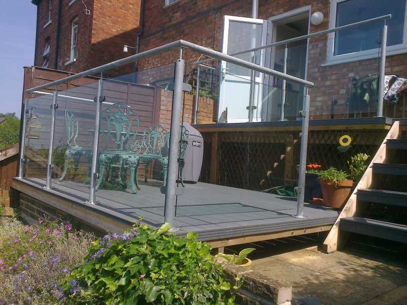 Galvanised steel posts and handrail with toughened glass infill