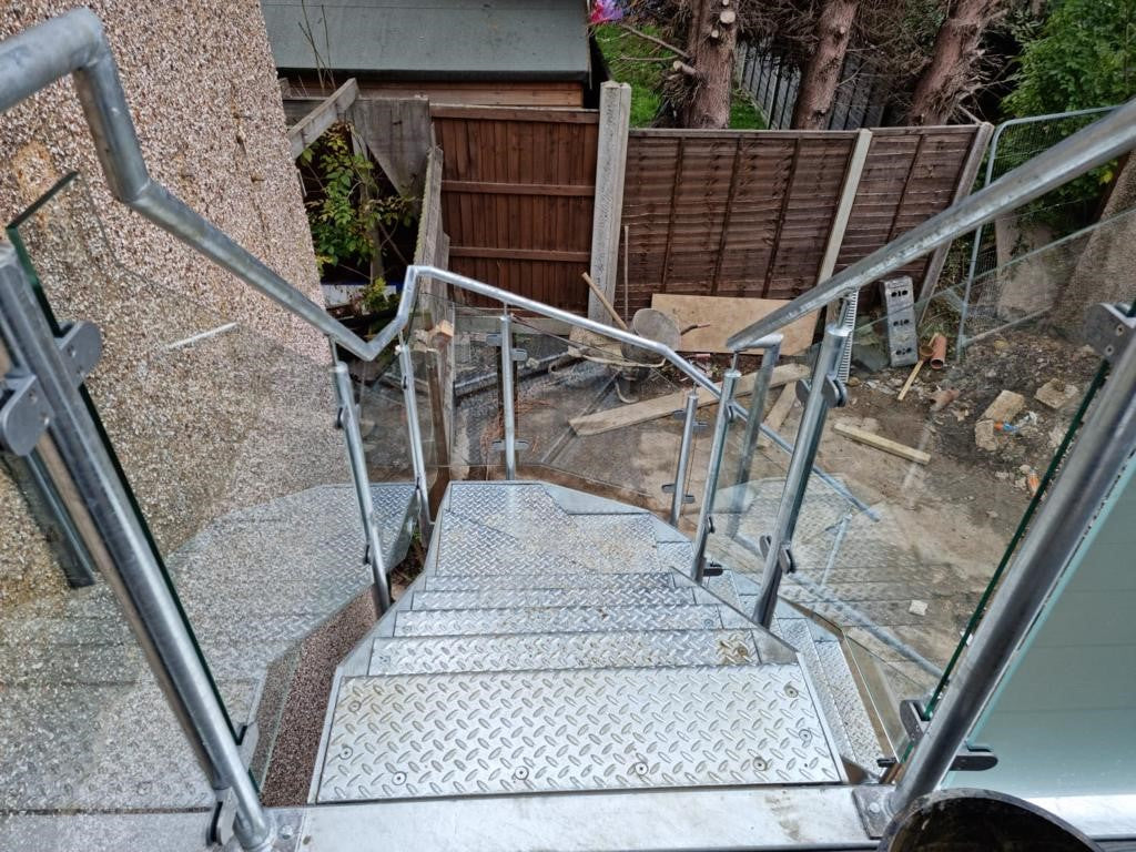 Hot dip galvanised glass balustrades in place