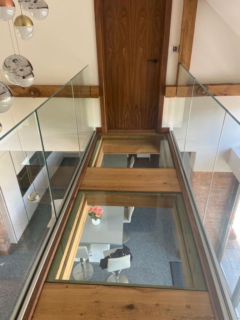 Walk-on glass floor panels in a gallery landing