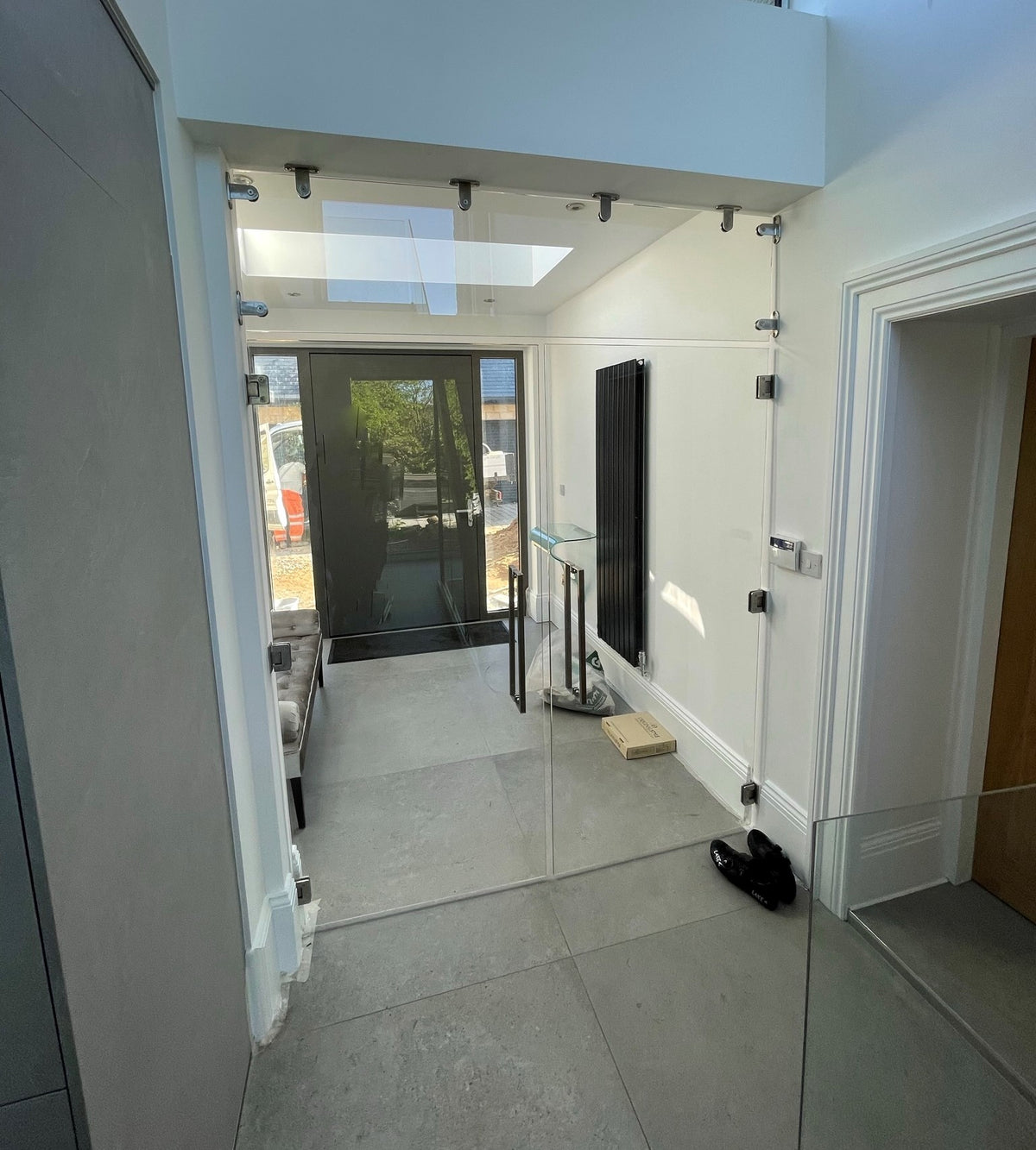 Frameless glass partition doors dividing a room