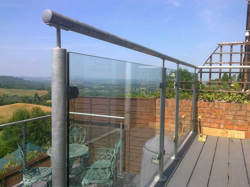 Hot dip galvanised steel and glass balustrade to a raised deck