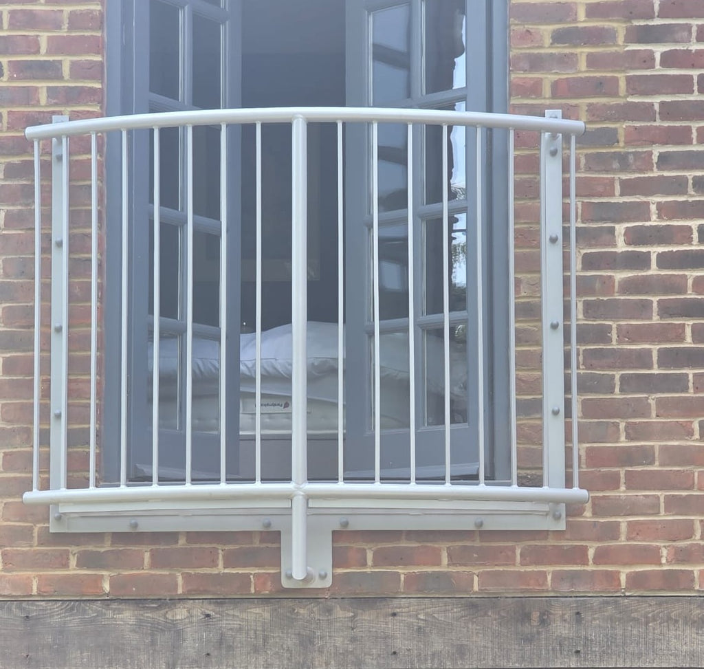 Lincoln curved Juliet balcony fitted across French doors, seen straight on